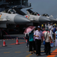 Visitors walk on China's first aircraft carrier Liaoning during an open day at a naval base in Hong Kong, China, July 9, 2017. Picture taken July 9, 2017.